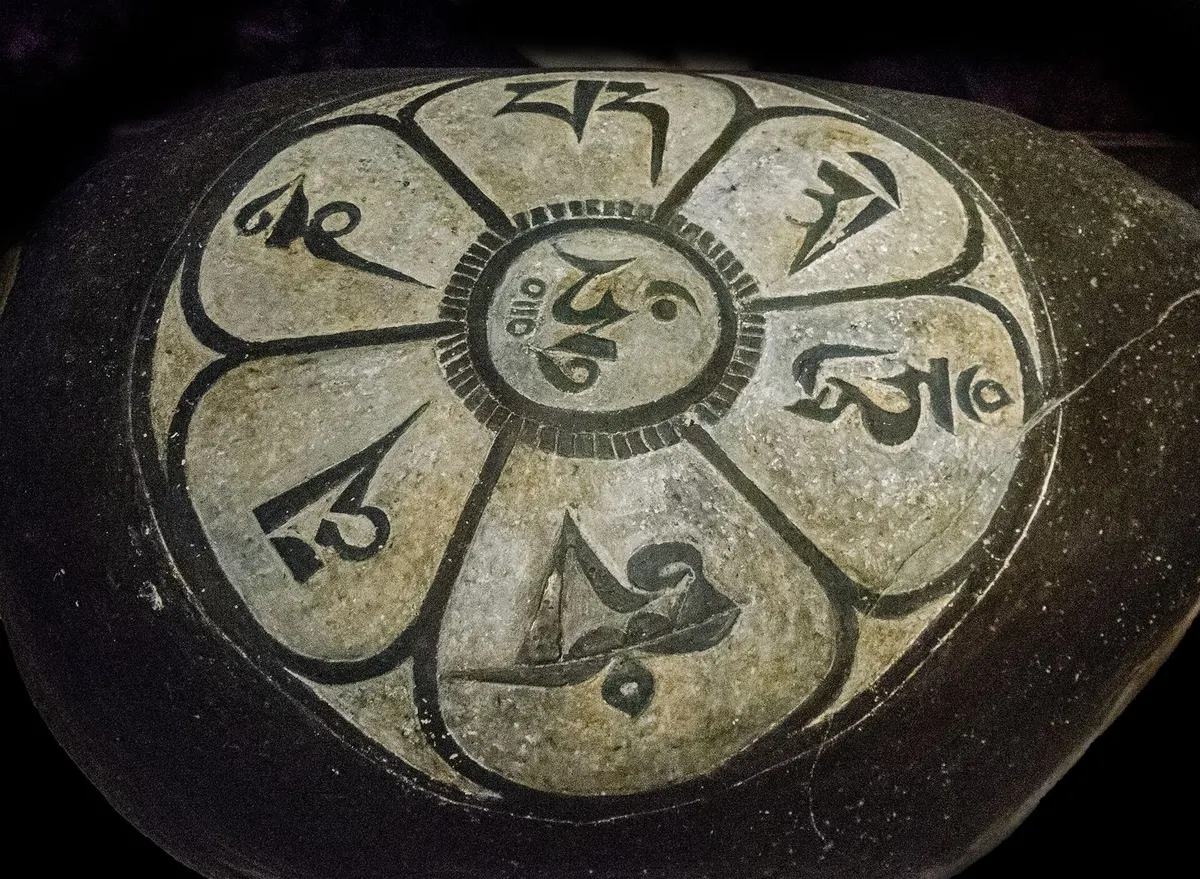 Carved mani stone